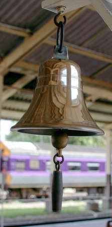 Brass bell in train stationの写真素材