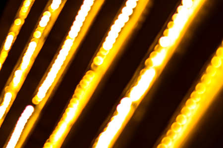 abstract background with bokeh defocused lightsの写真素材