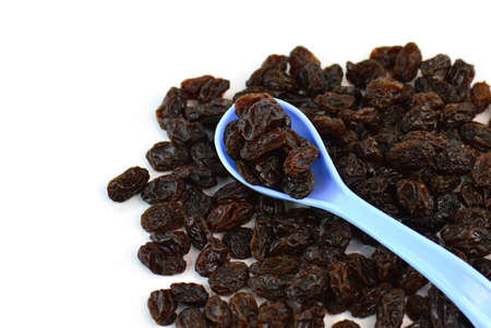 Dried raisins on a white backgroundの写真素材