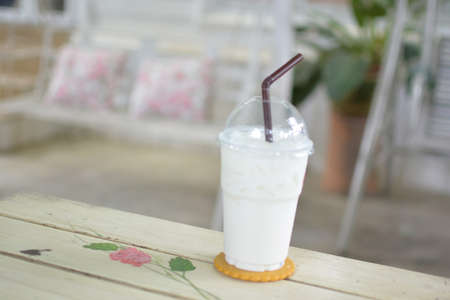 Fresh cold milk on wooden tableの写真素材