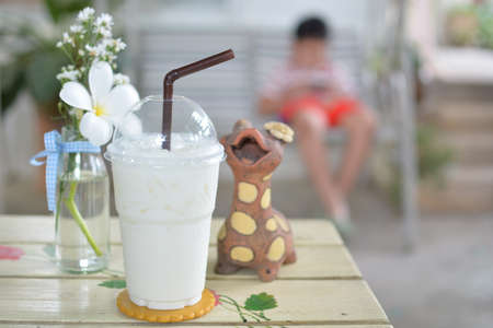 Fresh cold milk on wooden tableの写真素材