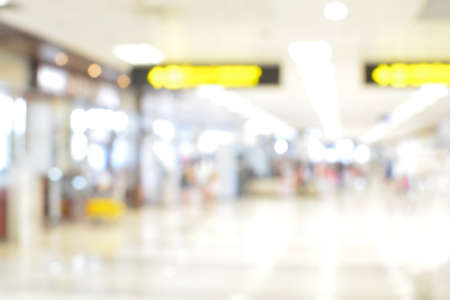 Blurred background : airport terminal blur background with bokeh lightの写真素材