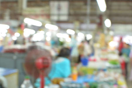 Blurred background : people shopping at night market , blur background with bokehの写真素材