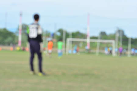 blurred background kid soccer player in academyの写真素材