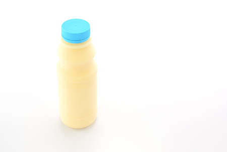 Milk Bottle with blue cap on White Backgroundの写真素材
