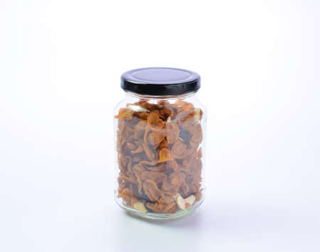 Granola Cereal in bottle on white backgroundの写真素材