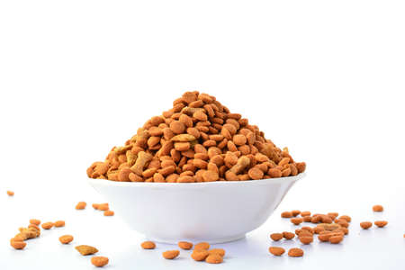 dog food treats in bowl isolated on white backgroundの写真素材