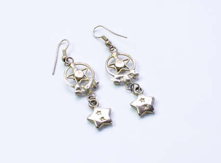 macro focus earrings on white backgroundの写真素材