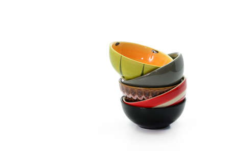 Stack of colorful cup on white background