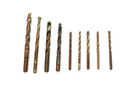 Set of steel drill bits on white background