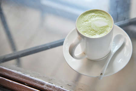 Hot green tea in a cup