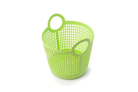 Basket green sphere plastic on white backgroundの写真素材