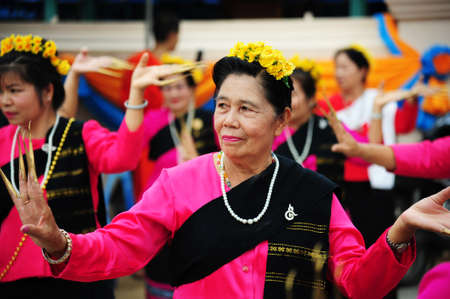 CHIANG-MAI, THAILAND - JULY 3: Thailand Festival for donating money to the temple for publishing Buddhism. The women dance to worship on July 03, 2017 at Chiang-mai province Thailand.のeditorial素材
