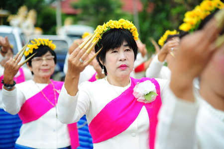 CHIANG-MAI, THAILAND - JULY 3: Thailand Festival for donating money to the temple for publishing Buddhism. The women dance to worship on July 03, 2017 at Chiang-mai province Thailand.のeditorial素材