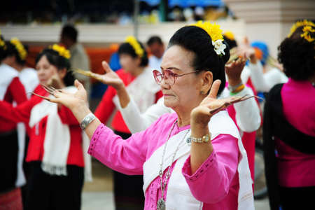 CHIANG-MAI, THAILAND - JULY 3: Thailand Festival for donating money to the temple for publishing Buddhism. The women dance to worship on July 03, 2017 at Chiang-mai province Thailand.のeditorial素材