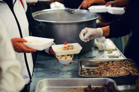 Feeding the poor. Poverty conceptの写真素材