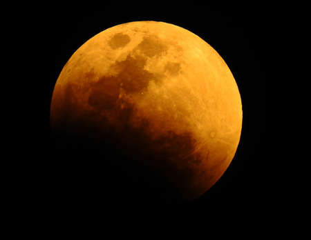 moon in shadows in dark sky