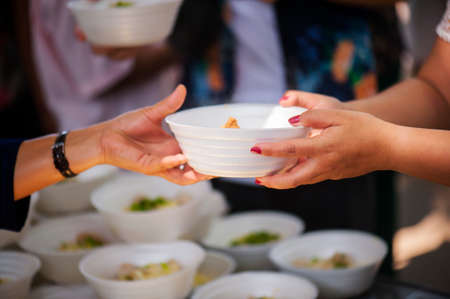 Feeding the poor Helping each other in societyの写真素材