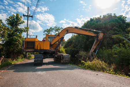 excavator dredging in small canal