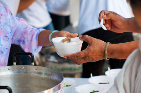 Feeding the poor to alleviate hunger. give concept