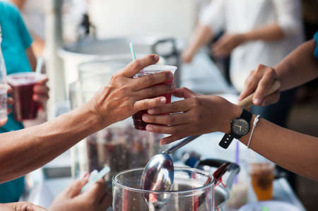 Feeding the poor to help each other in society. Charity conceptの写真素材