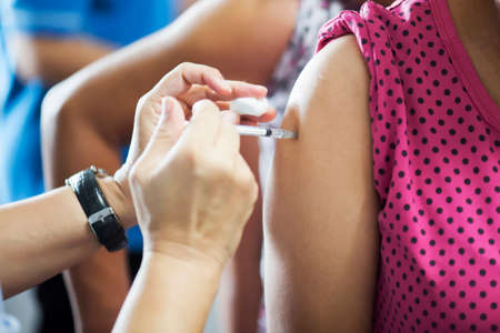 Patients received vaccines from doctors to prevent the disease. Medical conceptの写真素材