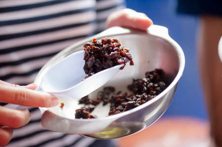 raisins in an aluminum cup