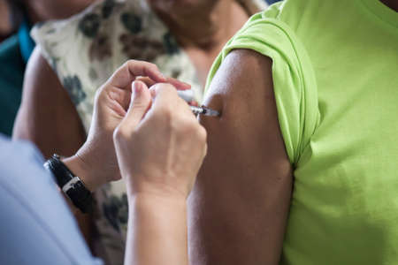 Doctors provide vaccinations to the public to help prevent influenza. Prevention conceptの写真素材