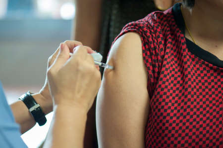 Doctors provide vaccinations to the public to help prevent influenza. Prevention conceptの写真素材