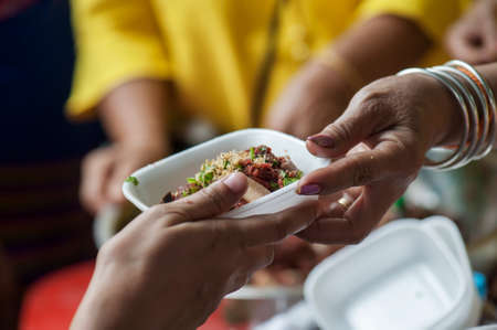 Feeding the poor to help and shareの写真素材