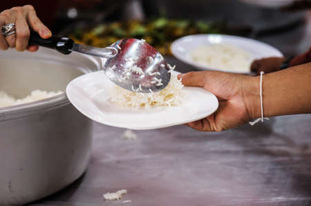 Donate leftover food to hungry people, Concept of poverty and hungerの写真素材