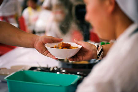 Sharing of food from volunteer hands to homeless people : The concept of feeding