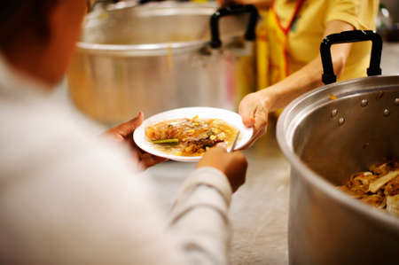 Helping Feed the Poor : The Concept of Hungerの写真素材