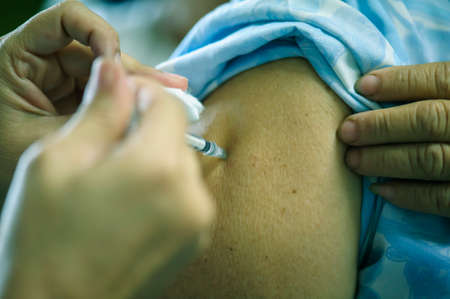 Medical staff vaccinated against influenza to the public at arms : Concept treatment and prevention.の写真素材