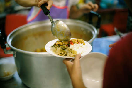 The Hope of the Poor by Donating Charity Food to the Immaculate : The Concept of Mindfulnessの写真素材