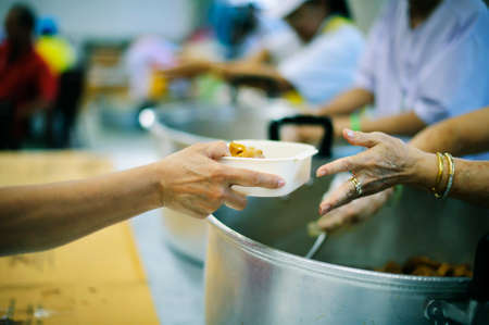 Participation in sharing food for the poor : the concept of food shortage in the world.の写真素材