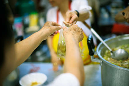 Donate Food with Love and Hope to the Poor : The Concept of Food Sharingの写真素材