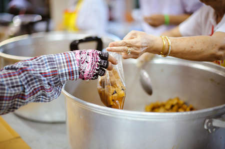 Charity food shared to everyone in society and the poor need this charity food.の写真素材