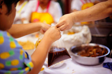 Concept of Feeding : Helping People With Hunger With Kindnessの写真素材