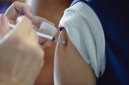 Patients are vaccinated on the arm to be immune to influenza : the concept of healing and health...