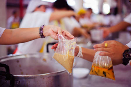 People outreach to donate food from volunteers : conceptual beggarの写真素材