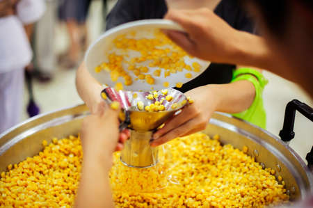 Donate food to the poor and the poor who suffer from starvationの写真素材