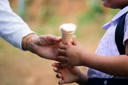 Donating food from the concern of human friends to the poor.の写真素材