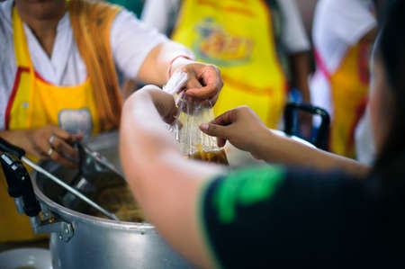 Feeding the poor Help them relieve hunger.の写真素材