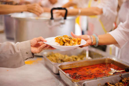 Distribute free food to the poor - share food for the hungryの写真素材