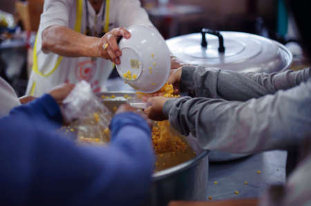 Feeding the Hungry : Make the poor equalの写真素材