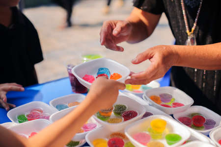 Volunteers collaborated to provide food to beggars with compassion.の写真素材