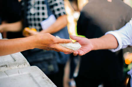 Food from the rich gives to the poor: a society of helpの写真素材