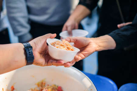 Feeding the poor to help and shareの写真素材