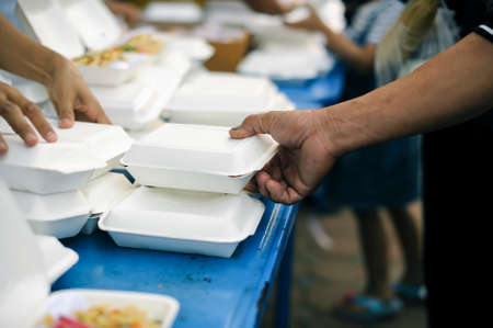 hands of the poor receive food from the donor's share. poverty conceptの写真素材